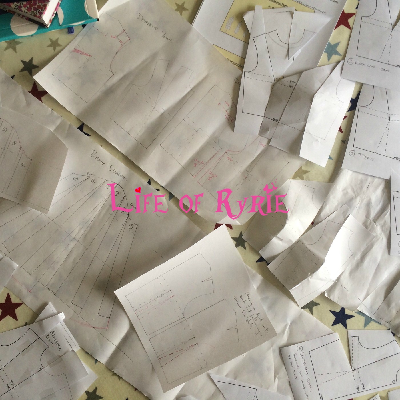 paper garment patterns scattered across a table